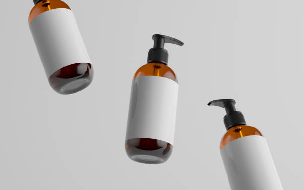 istock Amber Glass Pump Bottle Mock-Up - Liquid Soap, Shampoo Dispenser - Three Floating Bottles. Blank Label 1310818973