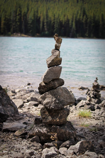 istock Cairn stacks built along a lake shore in summer 1310822356