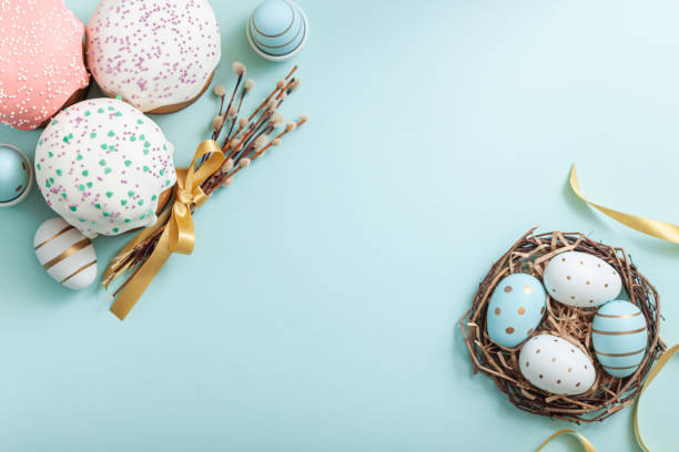 istock Easter russian cake and colorful eggs, flower on blue background. 1310822998