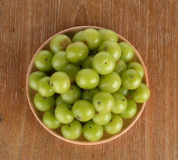 istock Indian gooseberry on wooden background 1310828315