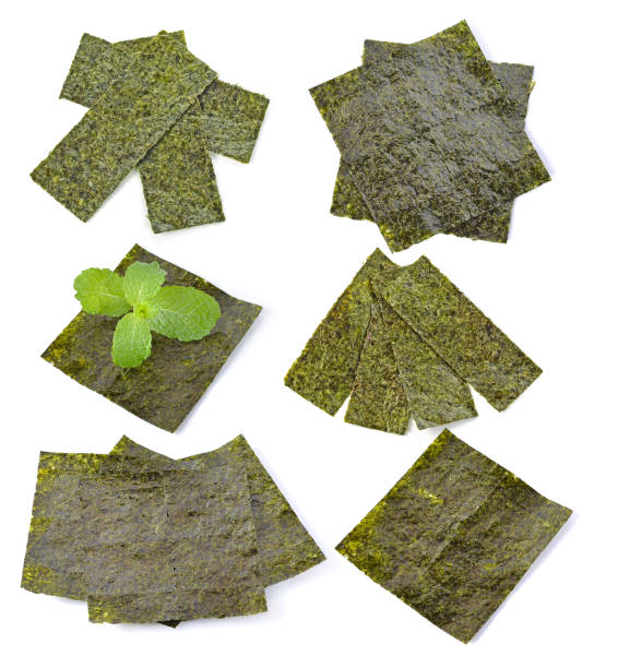 Sheet of dried seaweed,crispy seaweed isolated on white background Sheet of dried seaweed, Crispy seaweed isolated on white background. nori edible seaweed sheet stock pictures, royalty-free photos & images