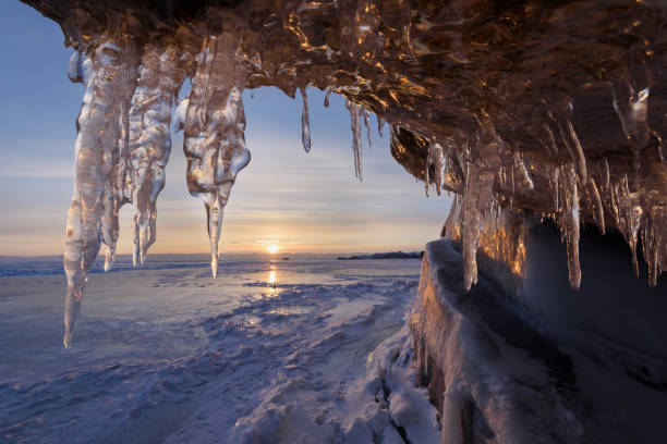 istock Lake Baikal in winter. Ice-covered cliffs with beautiful huge icicles 1310830403