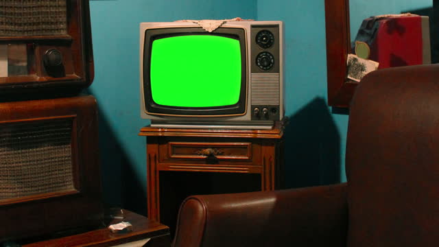 Retro television in vintage living room with chroma key screen