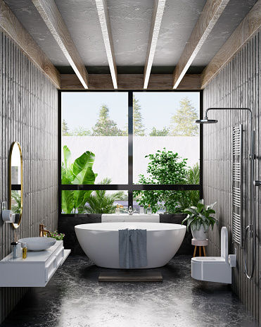 Soaking tub near a decorative window