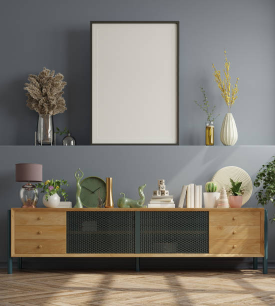 istock Mock up poster in modern living room interior design with dark blue empty wall. 1310831401