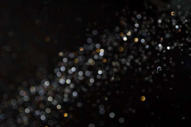 istock Black Bokeh Glittering stars of bokeh 1310831437