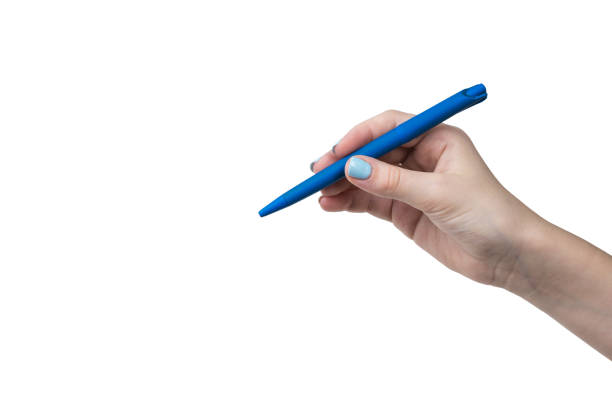 istock Female hand with blue makeup with blue ballpoint pen isolated on white background. 1310833007