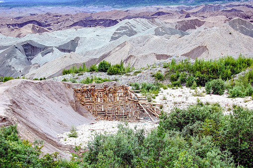 The Kennicott Mine, also called the Kennecott Mine, is located in Interior Alaska. This copper mine had its heyday in the early 1900’s. Located in the area known as McCarthy, this ghost town mine once employed hundreds of people.  Today it stands as a reminder of days gone by.  Visitors come from all across the world to step back into the days of the Kennicott Copper Mine.  This glacier field has a green tint to it. This comes from the copper in the dirt. During its heyday structures were created to hold back the ice and dirt. Today it is a reminder and a beautiful scene to observe.