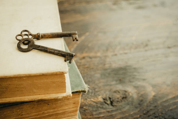 istock Old books and vintage keys. 1310836675