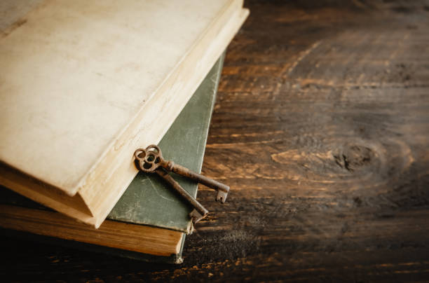 istock Old books and vintage keys. 1310836685