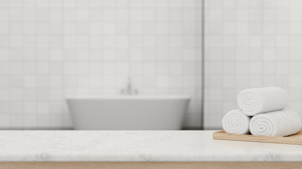 istock 3D rendering, marble counter in modern bath room with white towels and copy space 1310839622