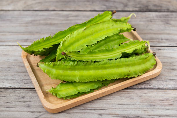 istock Psophocarpus tetragonolobus, Winged Bean on wood table 1310845159