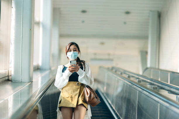 istock Woman with mask in station 1310846245
