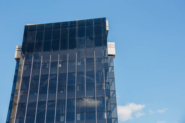 istock Exterior of modern building office building on a blue sky background 1310846308