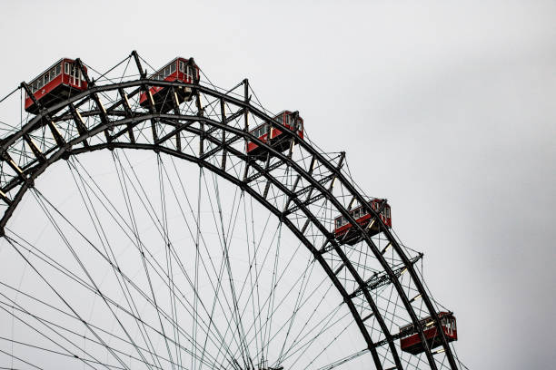 istock Partial view of a giant Ferris wheel and its gondolas on a cloudy day 1310849391