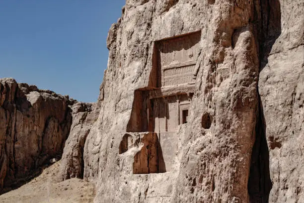 Tomb of a Persian King carved into the living rock. Ancient necropolis of Nasq-e rostam, near to Persepolis
