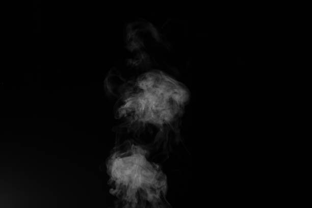 istock White smoke on black background. Figured smoke on a dark background. Abstract background, design element 1310852641
