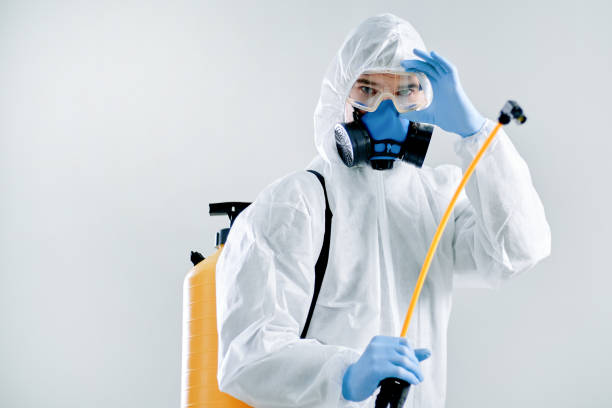 istock close-up. professional disinfector in a protective suit 1310854537