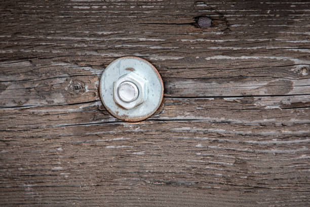 istock Bolt in Wooden Construction. Old Painted Wood 1310855663