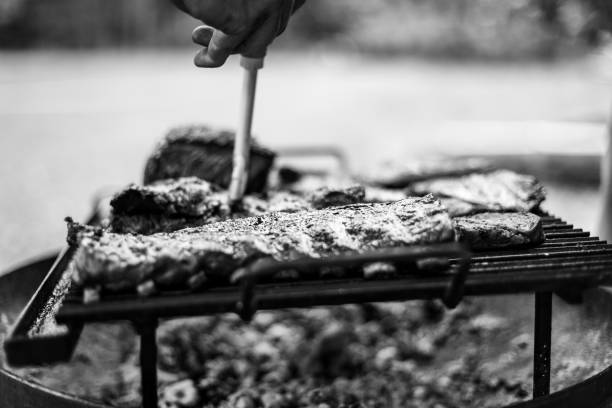 istock barbeque meat preparation in a summer day 1310856701