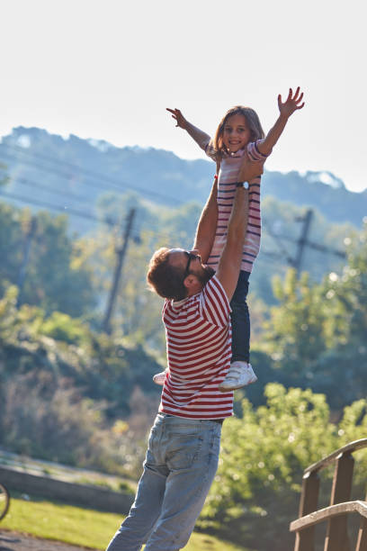 istock Daughter and father enjoying outdoors nature. 1310856855