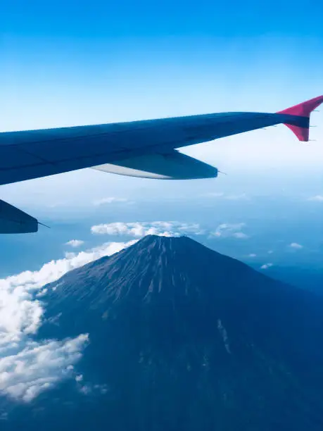 Photo of View through a passenger airplane window on a beautiful landscape.