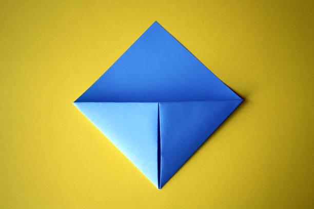 istock Step-by-step photo instructions. How to make an origami paper bookmark for a book. Classes with children. DIY. Step 8 1310858314