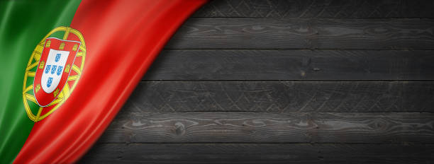 istock Portuguese flag on black wood wall banner 1310859613