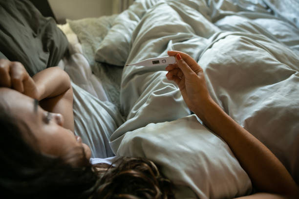 istock Sick woman in bed 1310860259