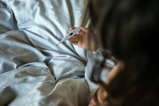 istock Sick woman in bed 1310860280