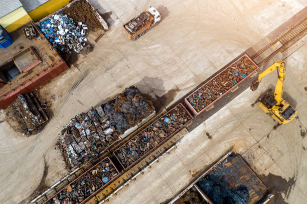 istock Scrap metal recycling loading into containers top view from the throne. 1310861013