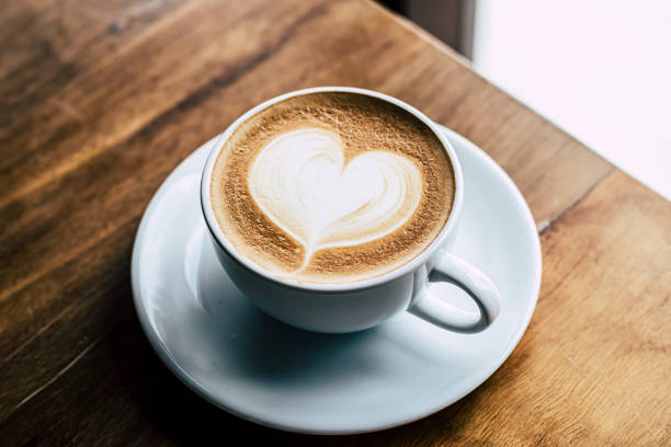 istock Cup of coffee latte with heart shape 1310863079