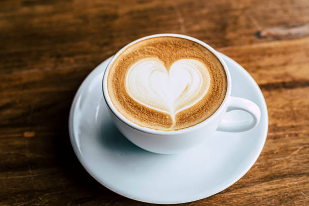 istock Cup of coffee latte with heart shape 1310863100