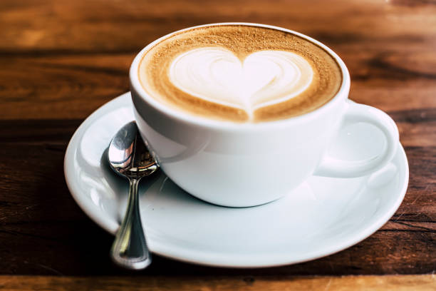 istock Cup of coffee latte with heart shape 1310863101