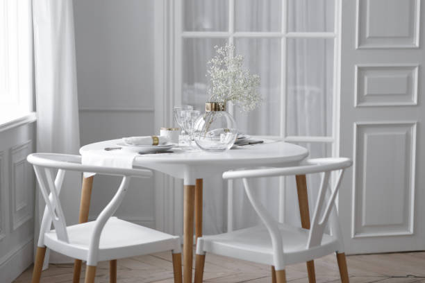 istock White loft interior in a Scandinavian style with a table. Set wooden table in a bright interior, photo studio. 1310864695