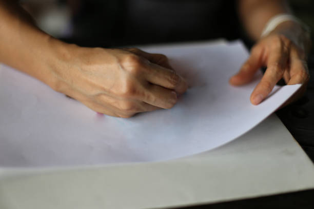 istock A person's hand drawing a picture 1310865398