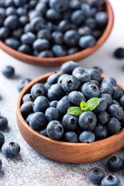 istock Fresh blueberries in a wooden bowl 1310865949