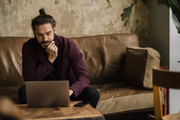 istock Young handsome Caucasian businessman casually working 1310868642