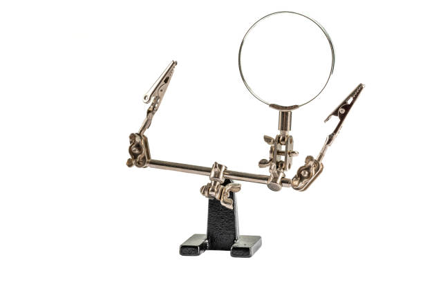 istock Helping hand with magnifying glass isolated on the white background. 1310869770