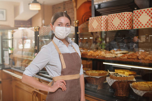 istock Female baker workin at her pastry shop 1310869956