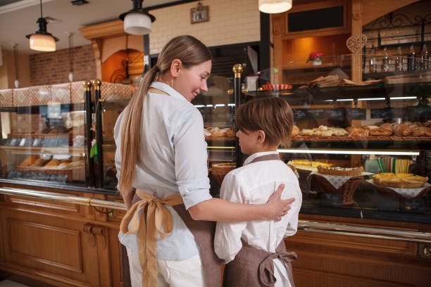 istock Mother an son working at their bakery shop 1310870028