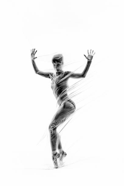 istock Graceful ballerina dancing with transparent nylon 1310870173