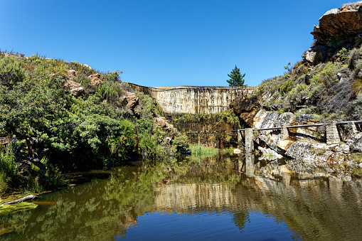 Inviting natural swimming pool in narrow gorge below old dam wall in Koue Bokkeveld Region of South Africa