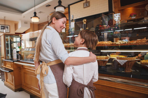 istock Mother an son working at their bakery shop 1310870236