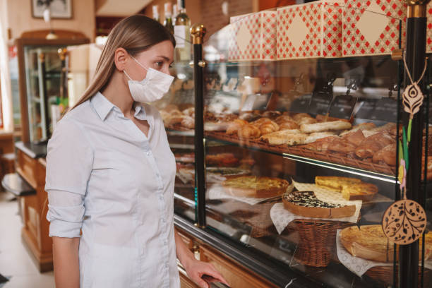 istock Woman shopping at bakery store 1310870287