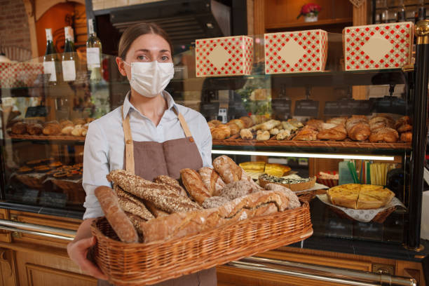 istock Female baker workin at her pastry shop 1310870301
