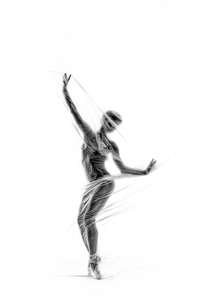 istock Graceful ballerina dancing with transparent nylon 1310870974