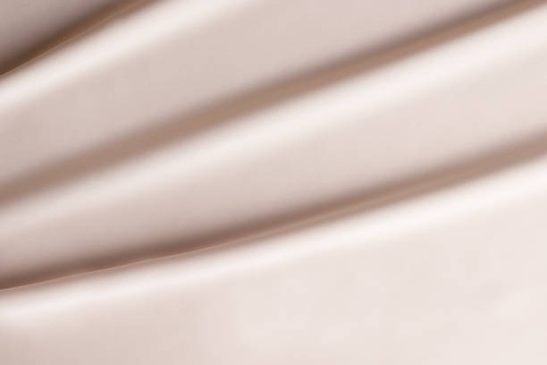 istock Texture of beige silk fabric. Copy space 1310871024