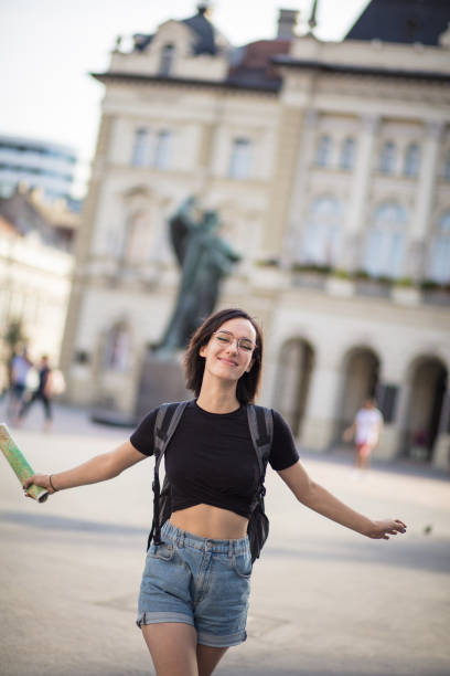 istock Woman on street with map in hand. 1310871389