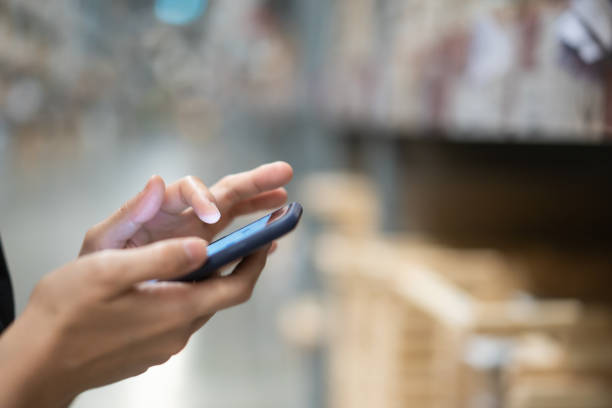 istock Woman using a smartphone to search a products 1310872540